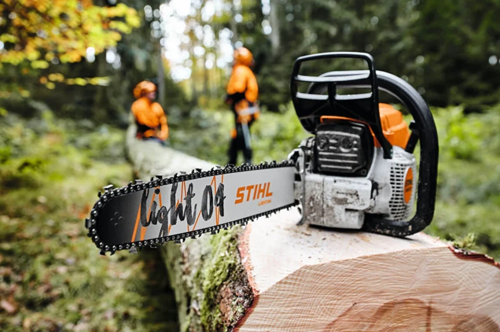 Stihl chainsaw on log of wood
