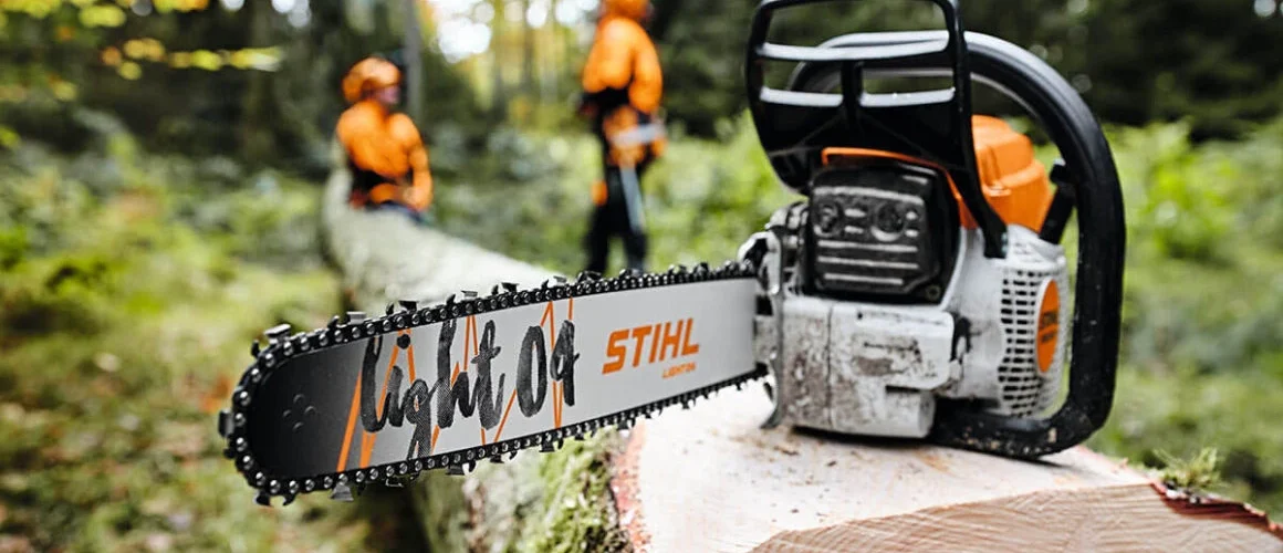Stihl chainsaw on log of wood